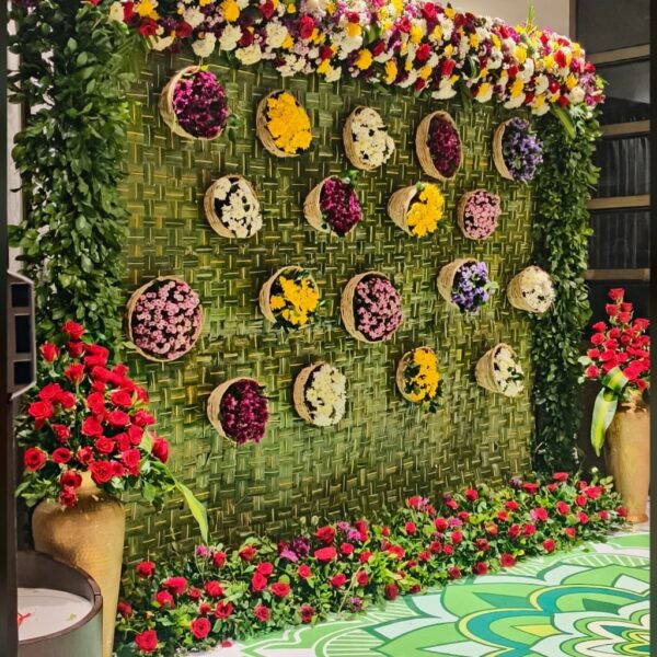 Vibrant Green Wall Backdrop with Basket Flowers