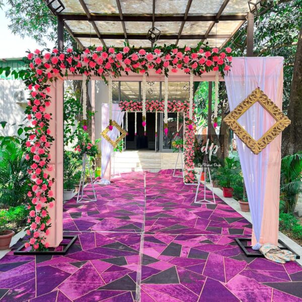 Pink and White Floral Walkway Decor with Red Carpet